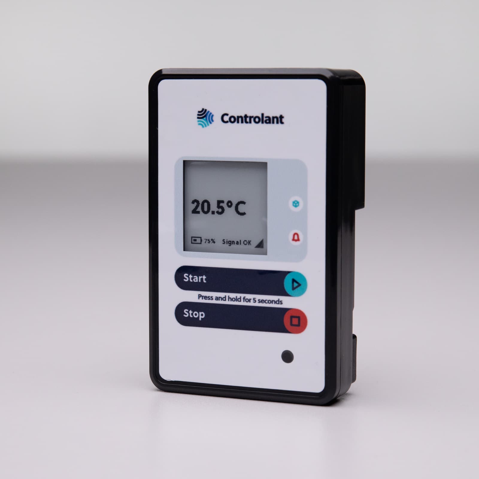 A Controlant Saga device standing on a white surface, its screen reading 20.5 °C