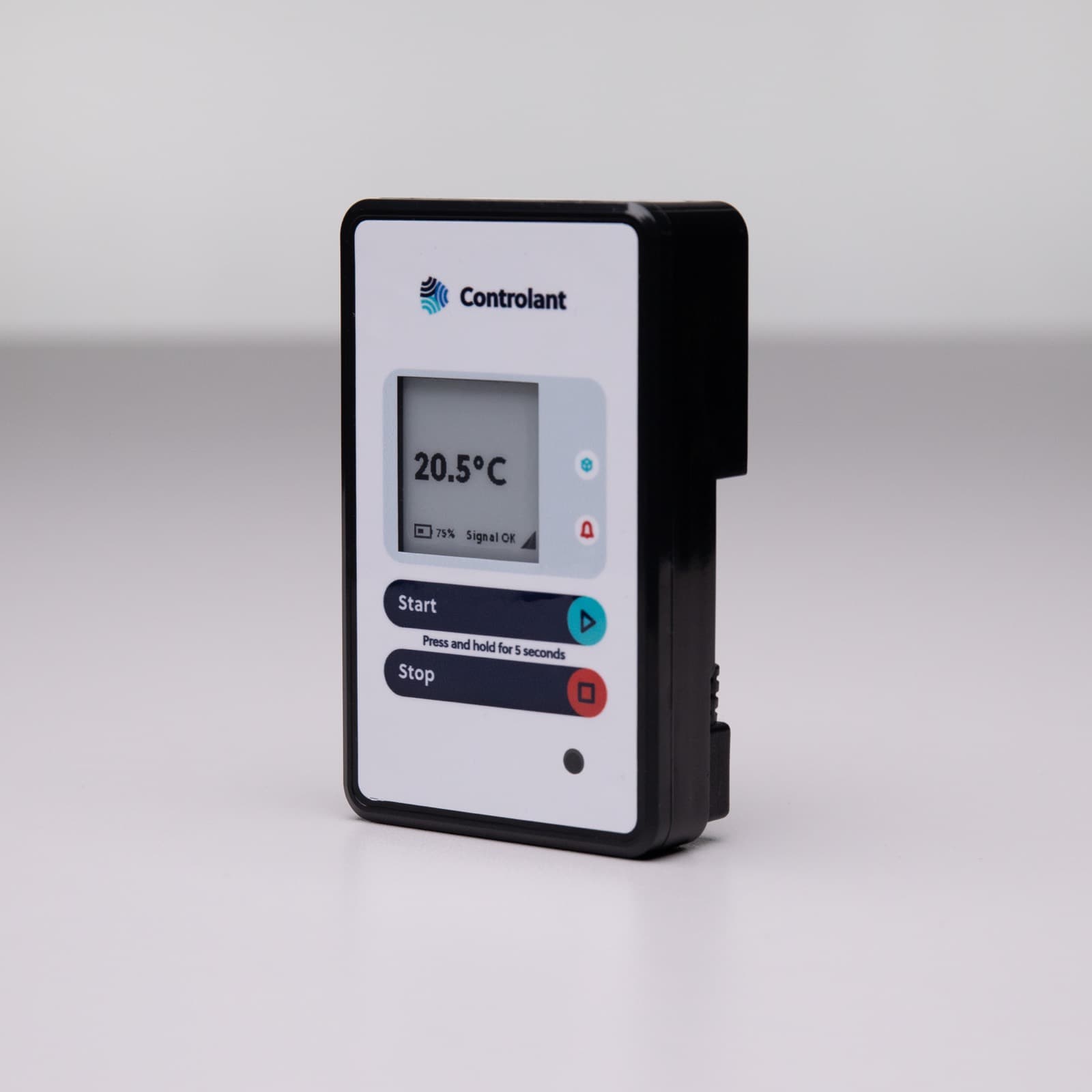 A Controlant Saga device standing on a white surface, its screen reading 20.5 °C